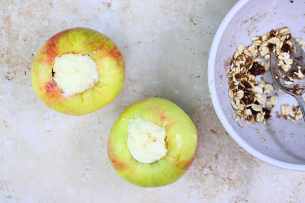 divide apple pie spice and oat mixture amongst apples and top with butter
