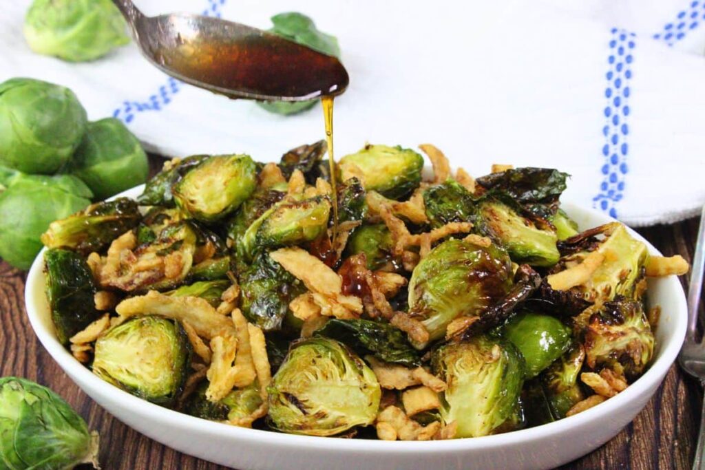 drizzling sauce over top of copycat red lobster brussel sprouts