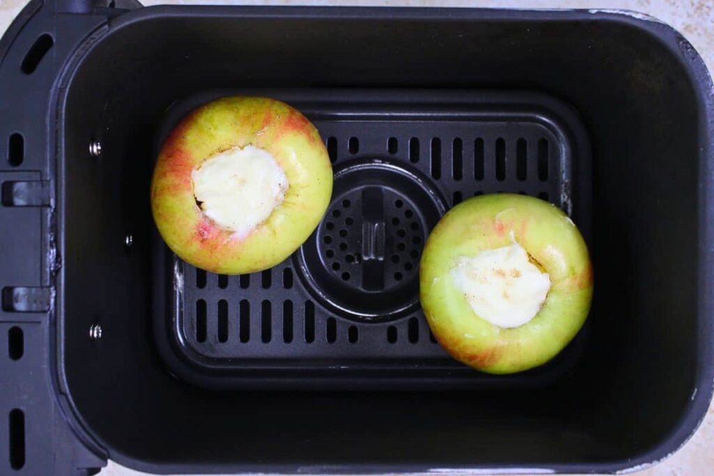 place filled apples in air fryer basket