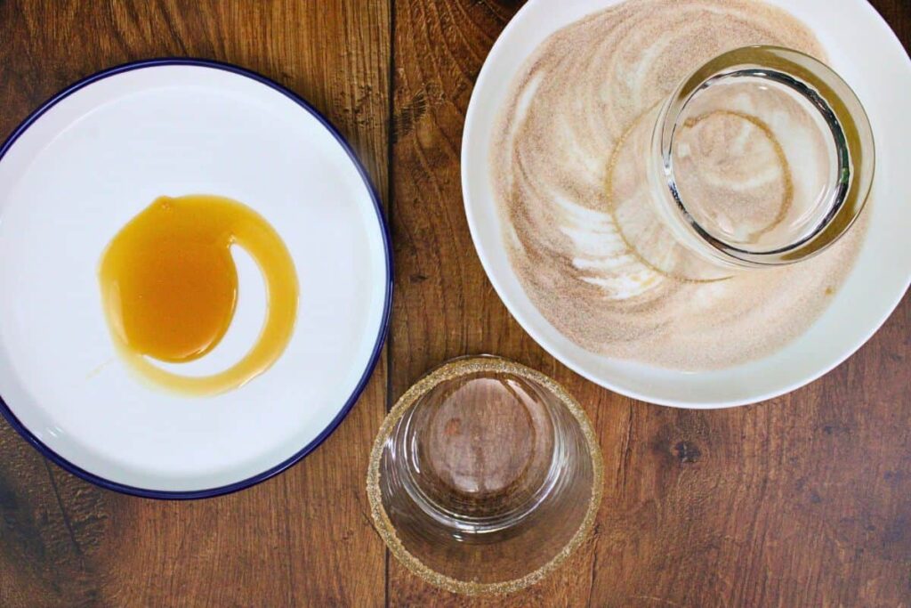 rim apple pie cocktail glass with caramel and cinnamon sugar mix