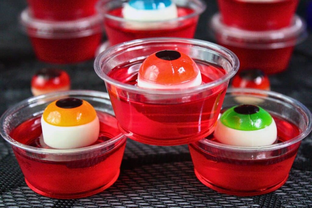 three different colored eyeball jello shots stacked in a pyramid