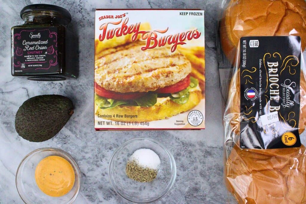 trader joes frozen turkey burgers in packaging with fresh added topping choices