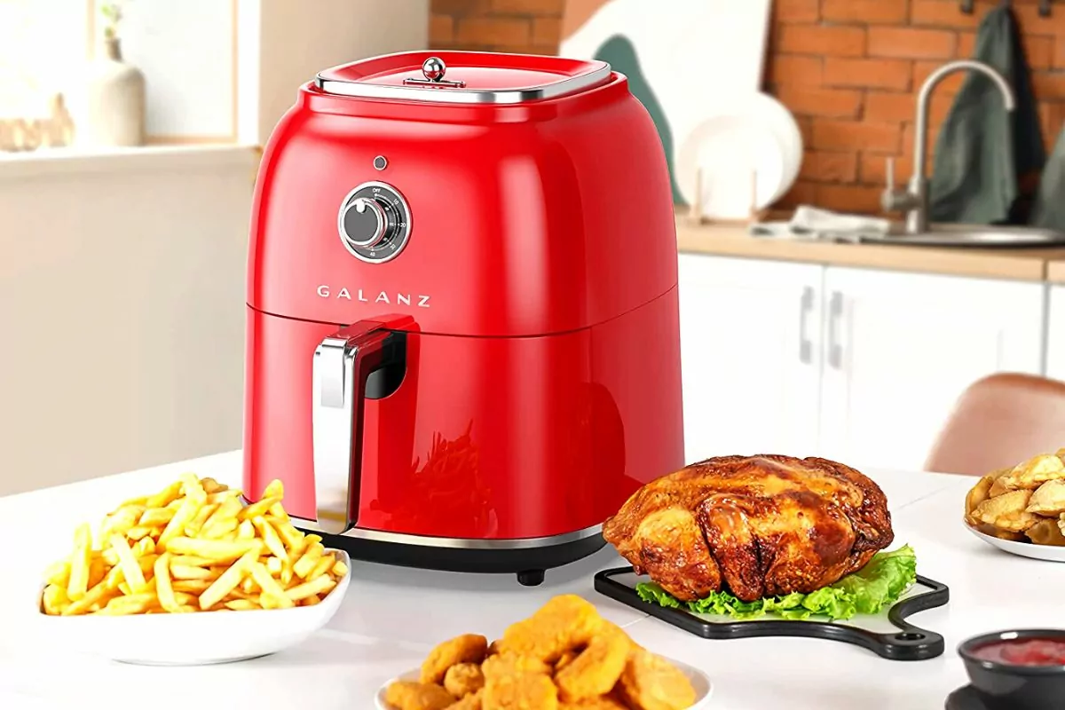 galanz red retro air fryer on counter with fries and chicken nuggets