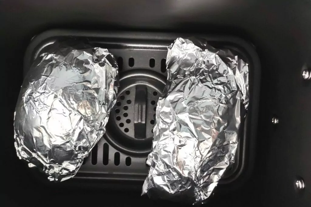 place foil wrapped potatoes in air fryer basket