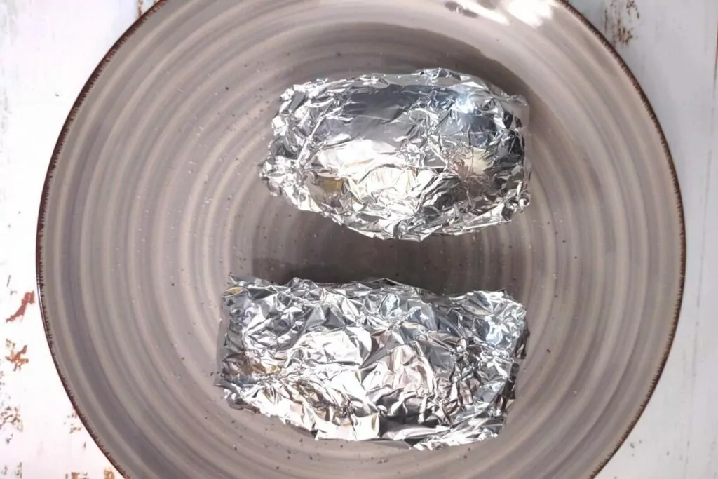 wrap russet potatoes in aluminum foil
