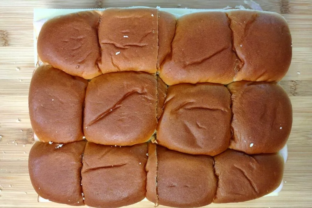 cover the turkey and cheese with the top slider buns