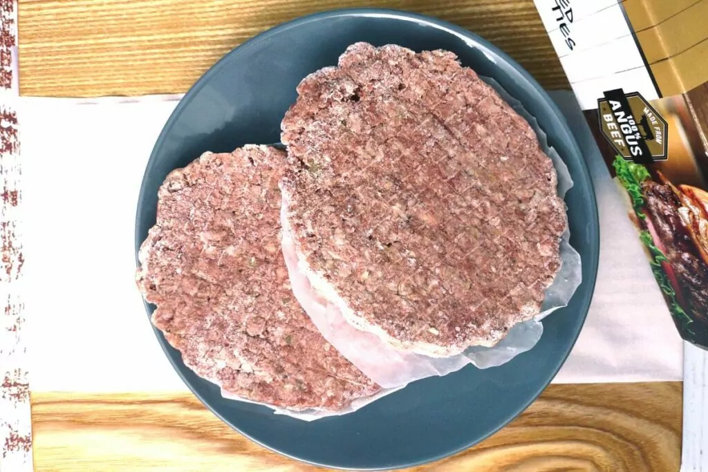 remove frozen hamburger patties from all packaging