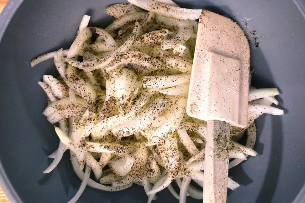 season onion slices with salt and pepper to taste