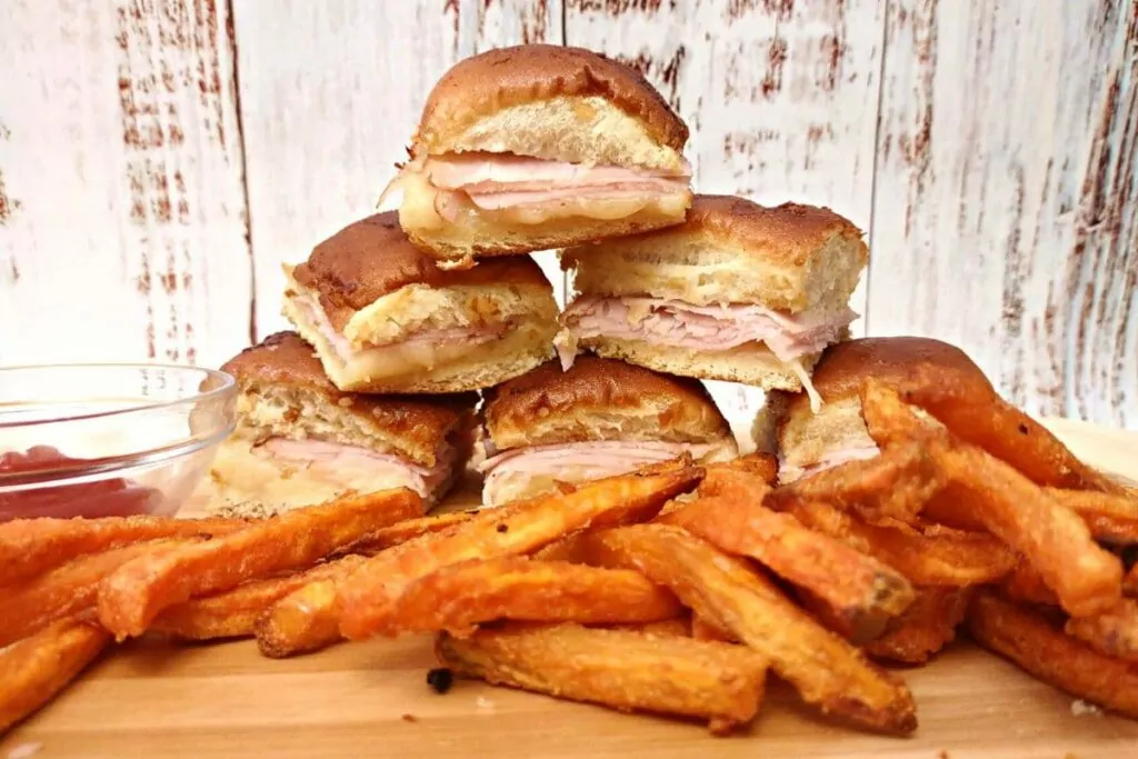 stacked turkey sliders with sweet potato fries in front