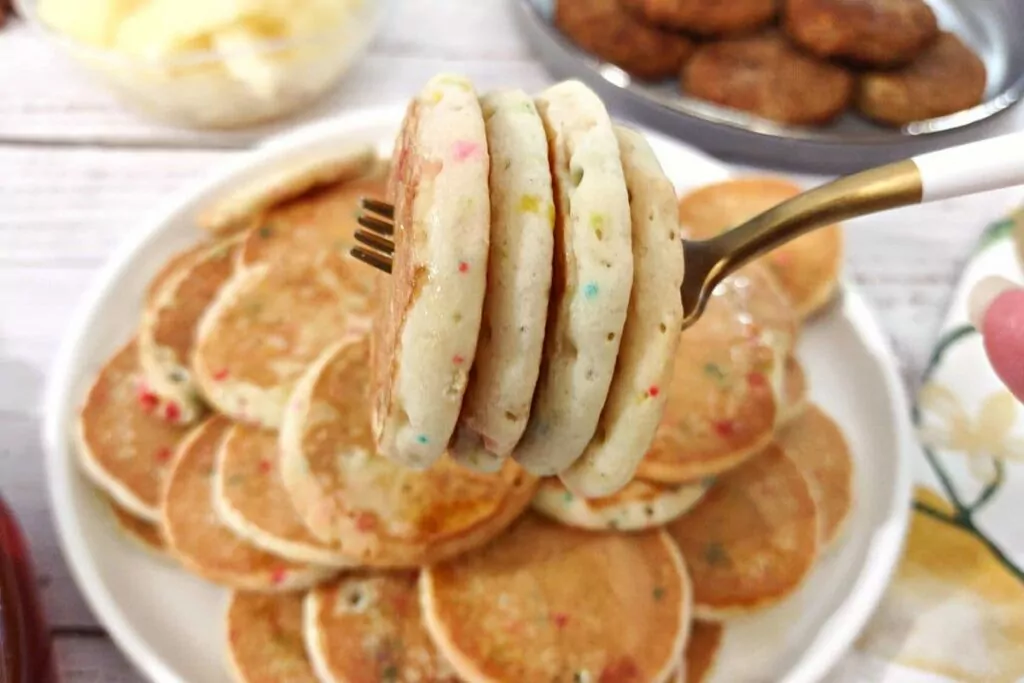 four mini pancakes cooked in the air fryer on a fork