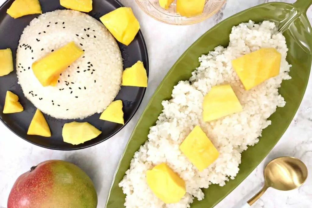 overhead view of microwave sticky rice with mango slices on top