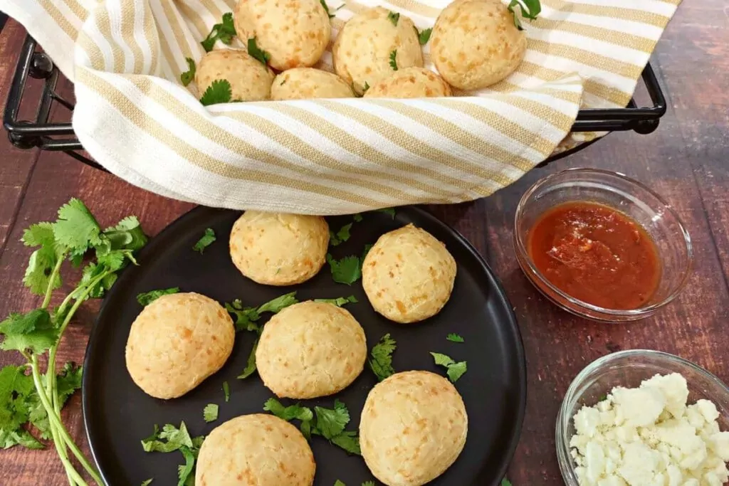 trader joes brazilian cheese bread with marina dipping sauce and cheese crumbles