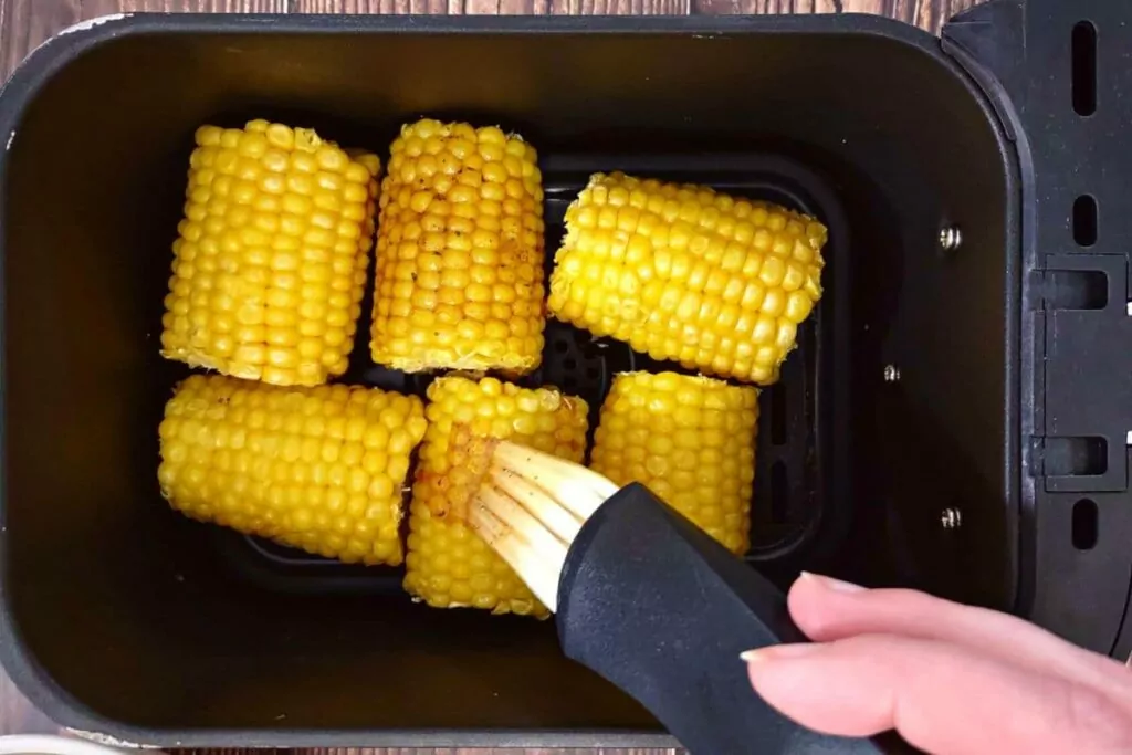 brush corn on the cob with melted butter sauce