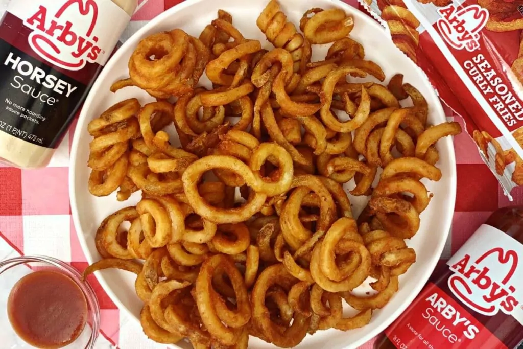 overhead view of arbys curly fries on a plate