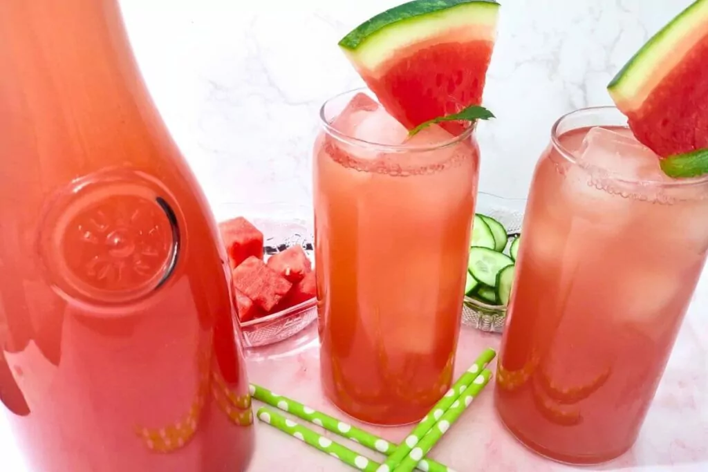 ice cold glasses of watermelon cucumber agua fresca with fresh watermelon slices