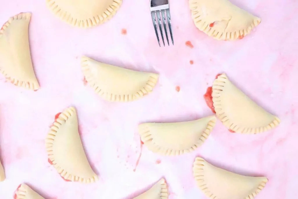 seal strawberry hand pie edges with a fork
