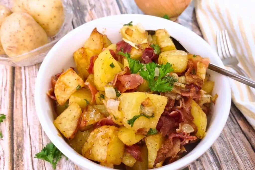 delicious and easy air fryer german potato salad in a white bowl