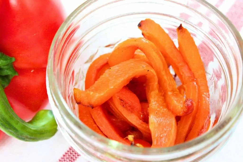 easy roasted red pepper slices in a glass jar
