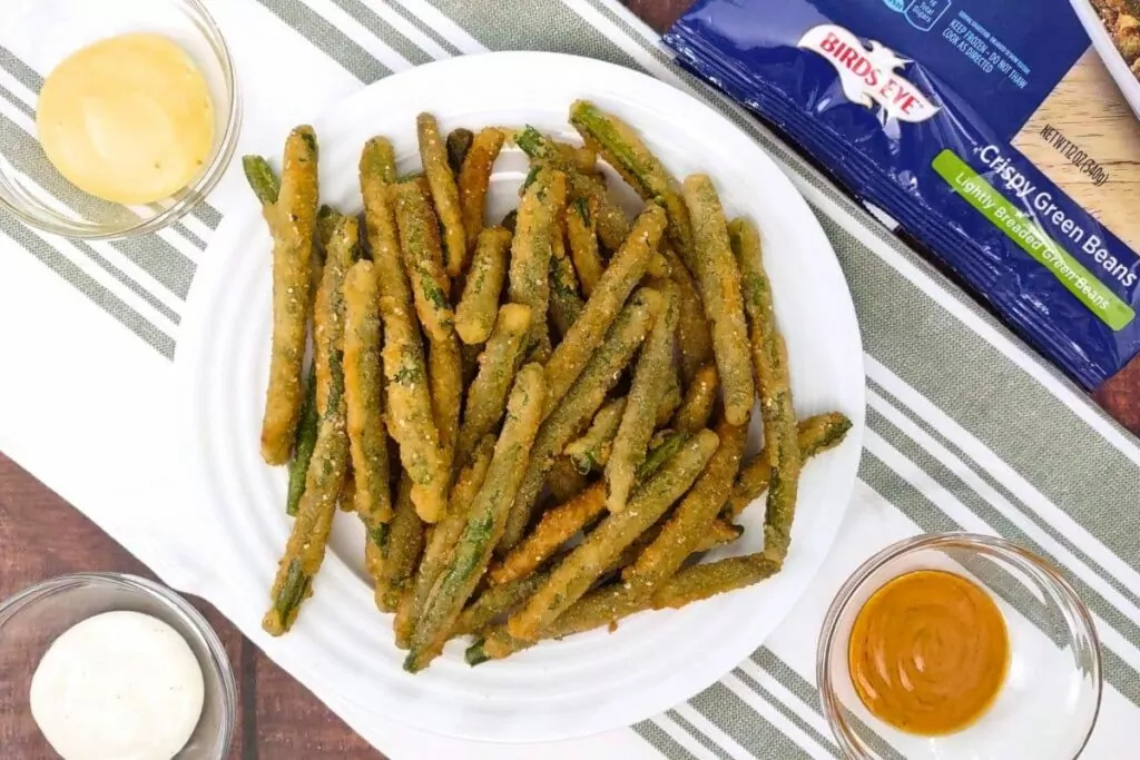 overhead view of air fryer crispy green beans on a plate