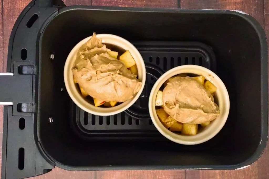 place mini apple cobblers in air fryer basket