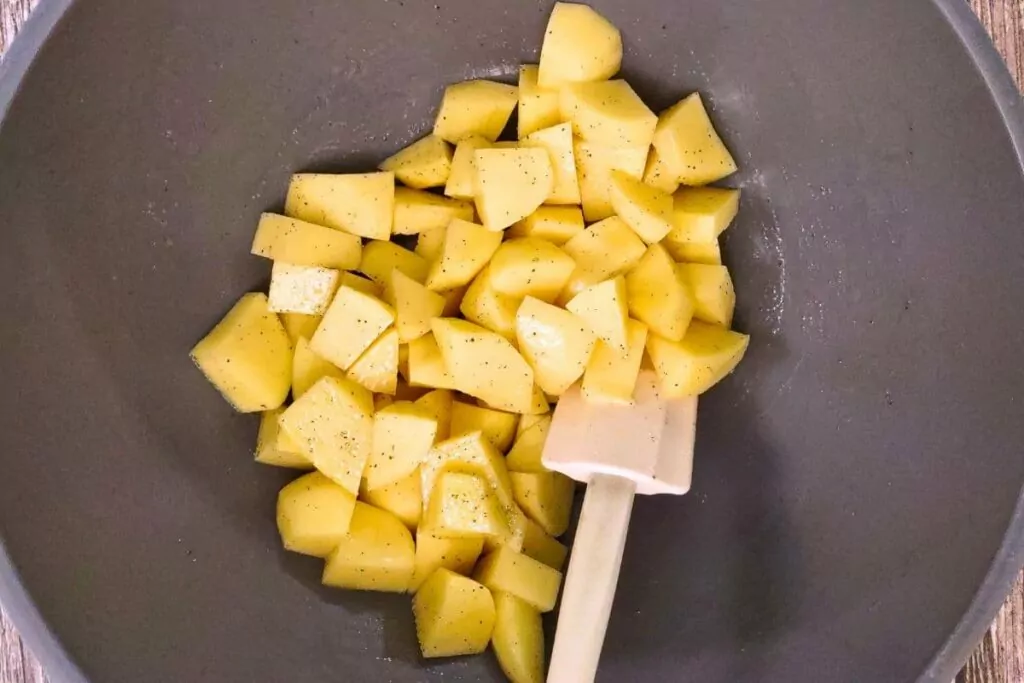 toss potato cubes in olive oil, salt, and pepper