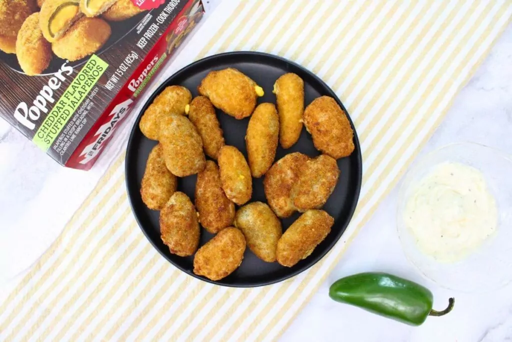 overhead view of tgi fridays jalapeno poppers on a plate