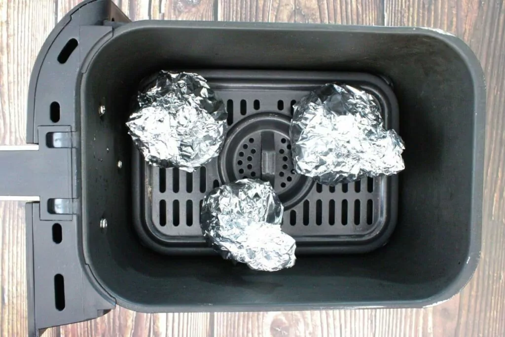 place foil wrapped beets in air fryer basket