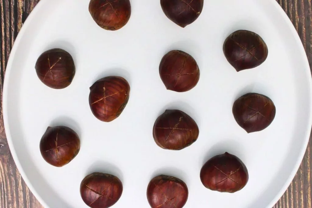 evenly space your chestnuts on a microwave safe plate