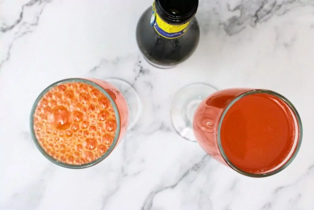 top blood orange mixture with chilled champagne