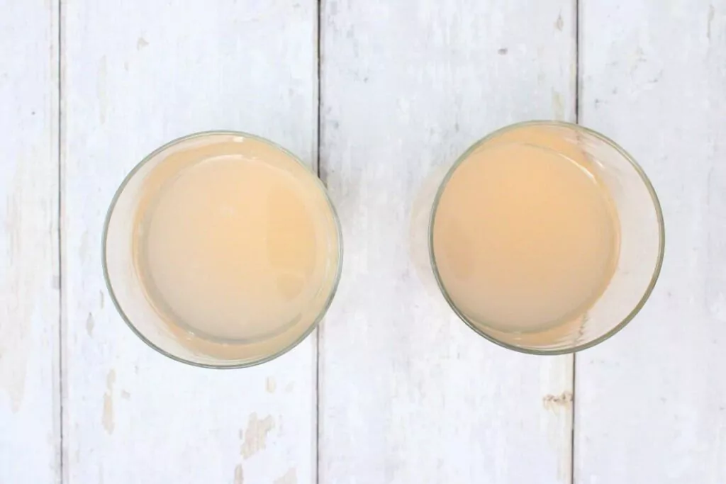 add gin and pink lemonade to a lowball glass