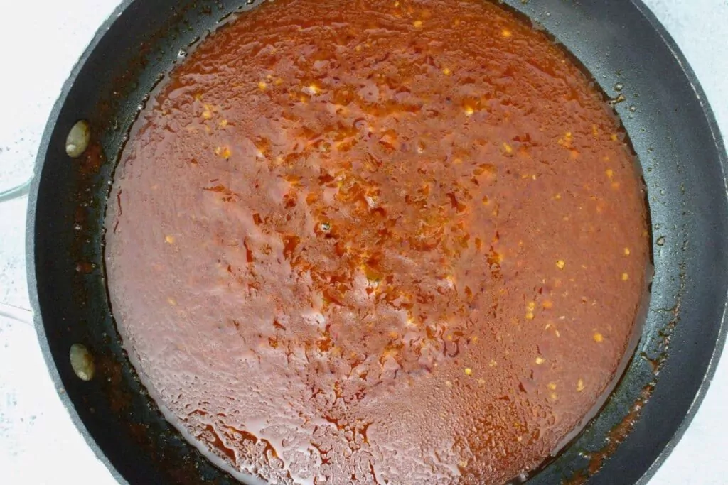 add in tomato paste, vinegar, salt, pepper, and red pepper flakes to finish and thicken bravas sauce
