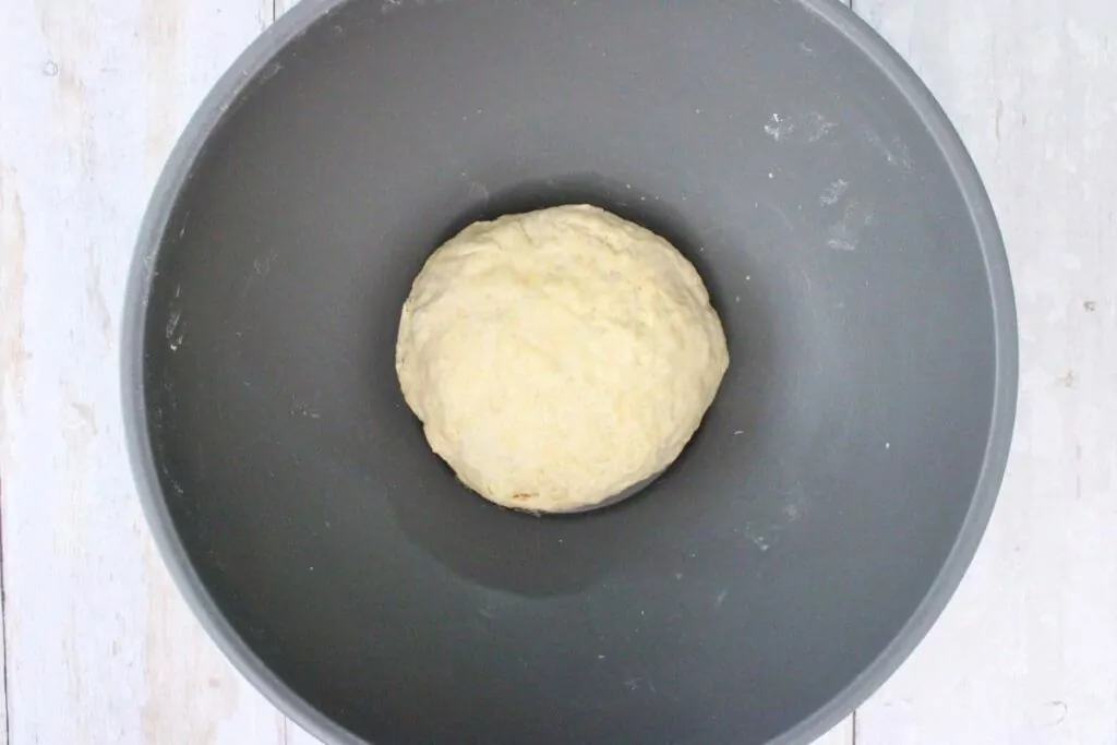 add shortening and warm water and stir until the dough forms