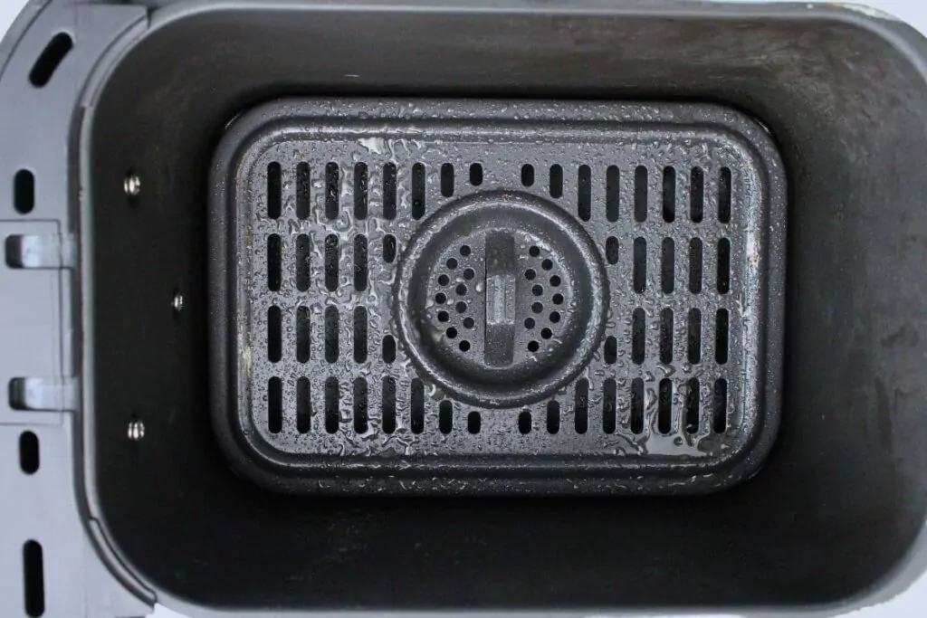 first spray air fryer basket before adding momo