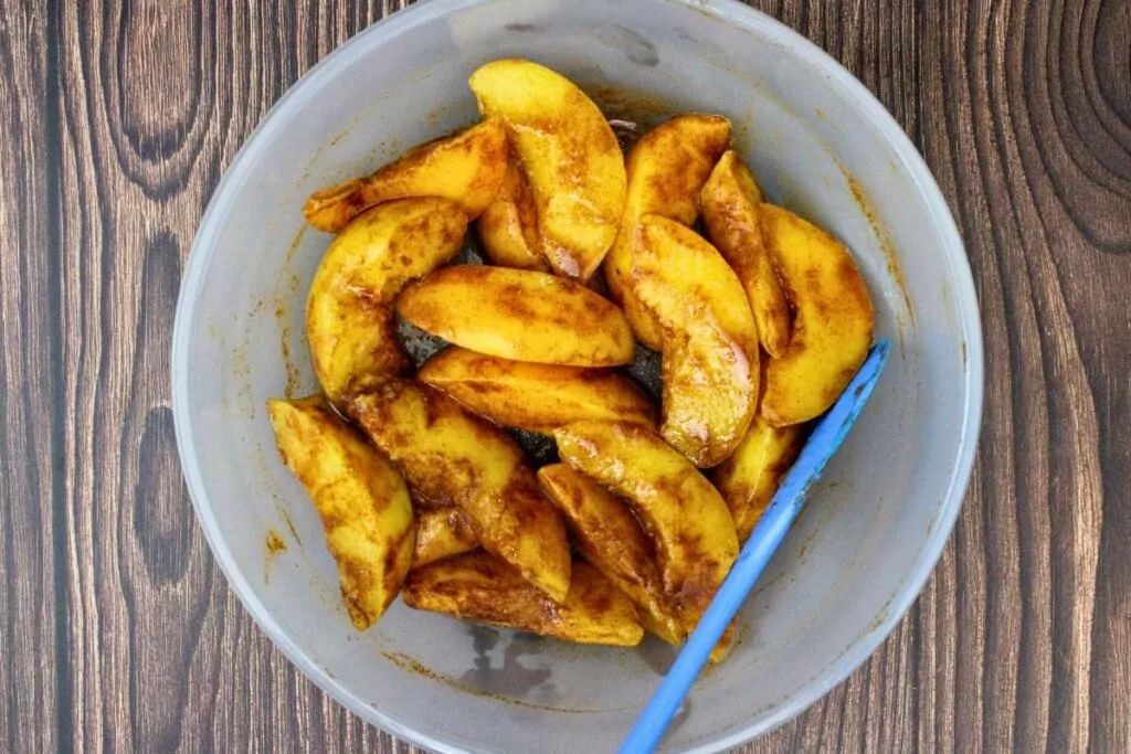 add drained peaches, vanilla, and cinnamon to a microwave safe dish