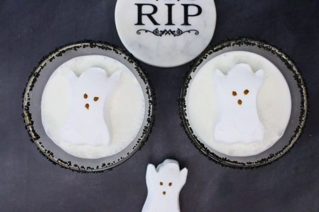 overhead view of two ghost martinis with ghost peeps on top