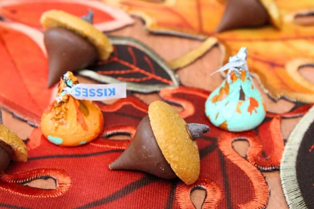 hershey kiss acorns with chocolate candy on a thanksgiving fall table