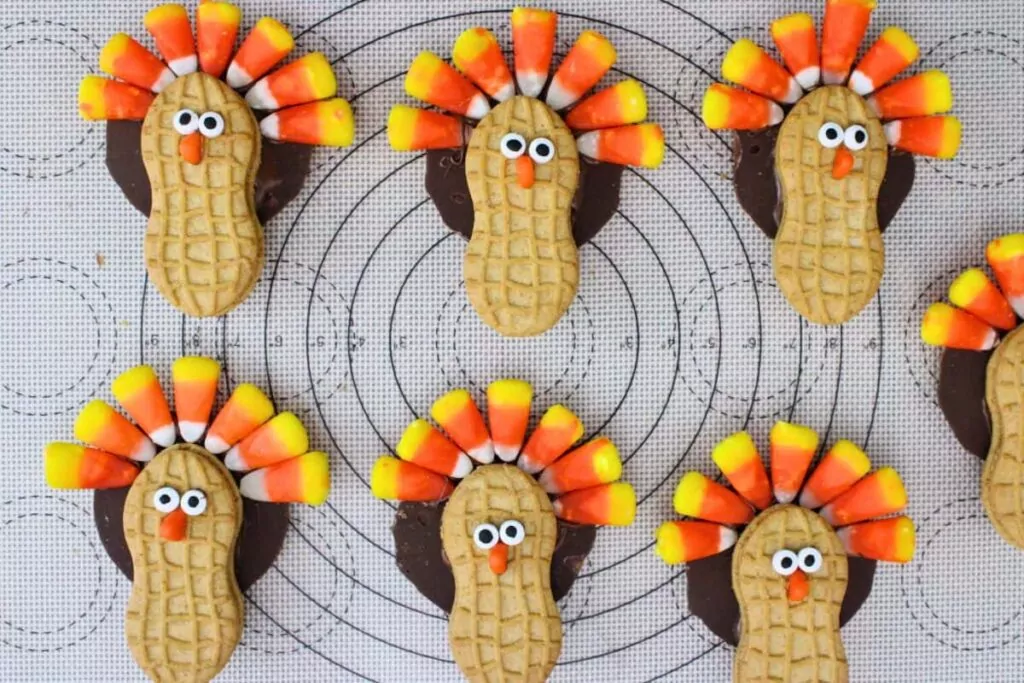 press candy corn tips into the fudge stripe cookie