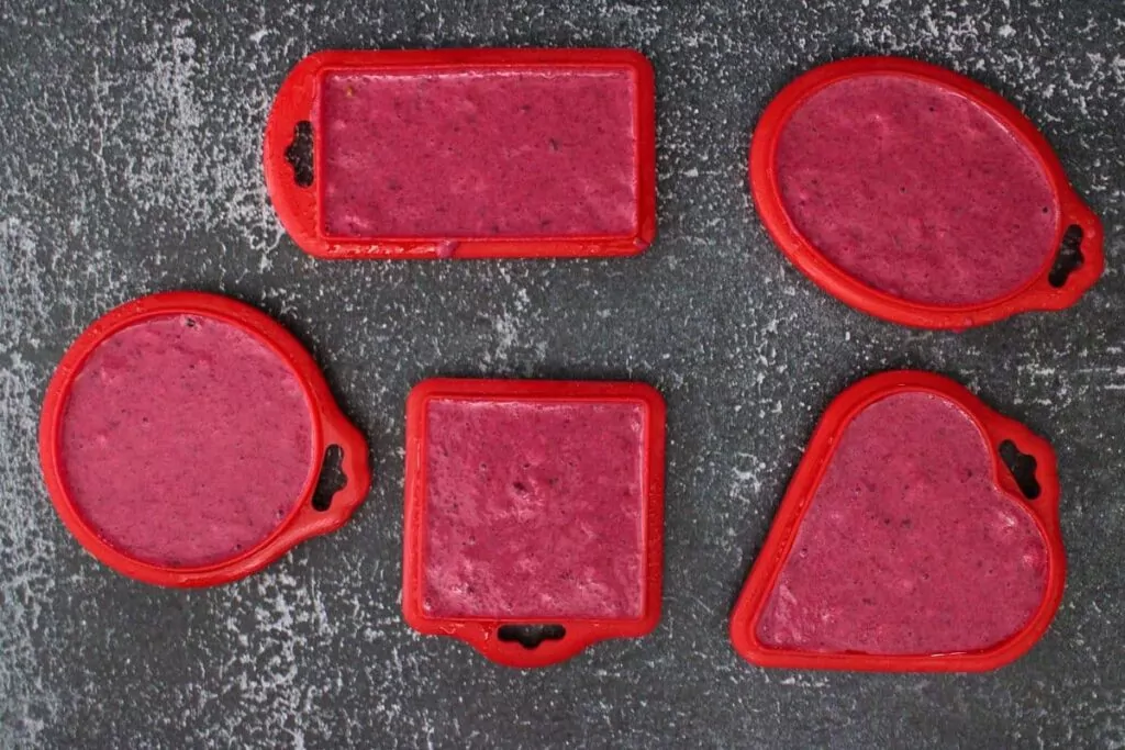 spread beetroot waffle batter in molds