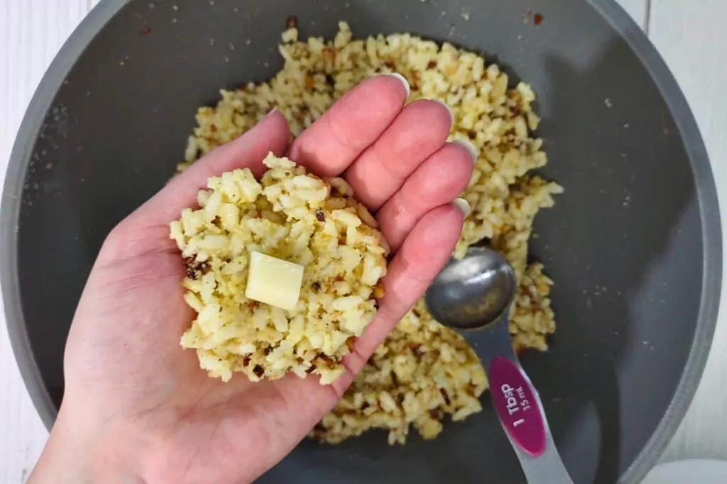 add a mozzarella cube to the rice mixture
