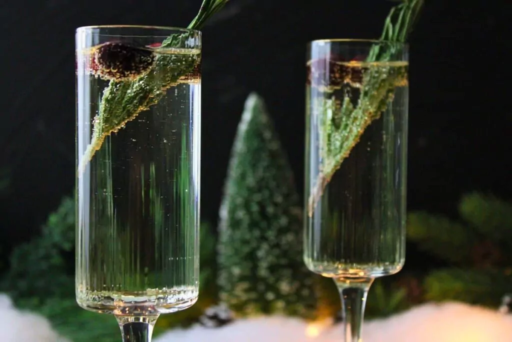 closeup view of two bubbly white christmas mimosa cocktails