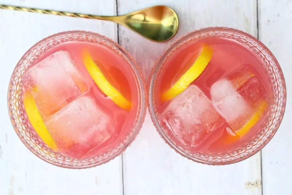 pour in vodka, pink lemonade, and fruit punch to prepared glasses