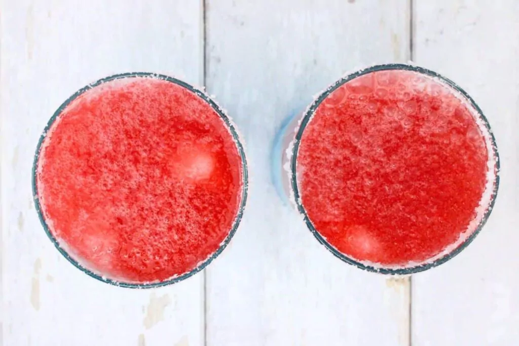 finally top the margarita with the red slush mixture