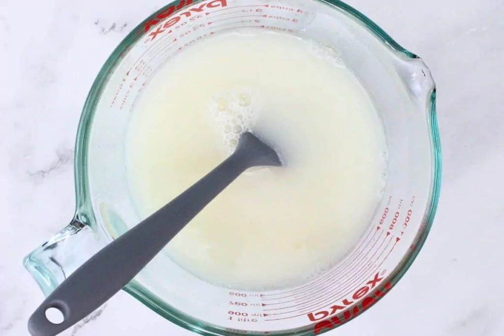 mix unflavored gelatin with boiling water then stir in coconut rum and sweetened condensed milk