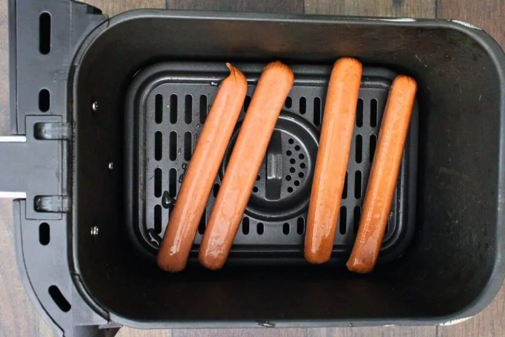 place hot dogs in air fryer basket