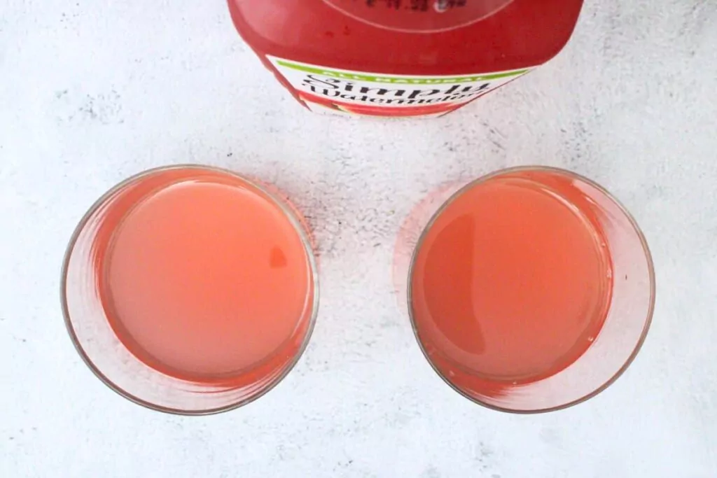 add gin and watermelon juice to rocks glass