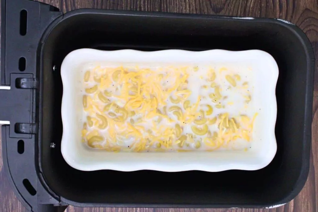 place macaroni filled dish in air fryer basket