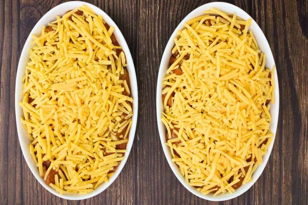cover hot dog mixture with shredded cheese