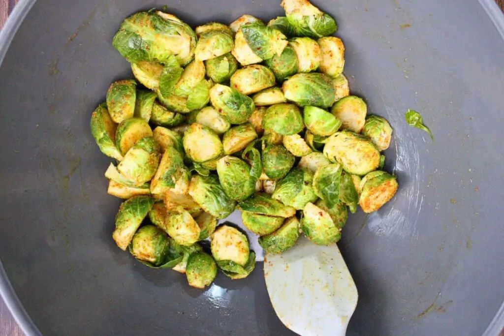 mix brussel sprouts with melted butter and seasoning
