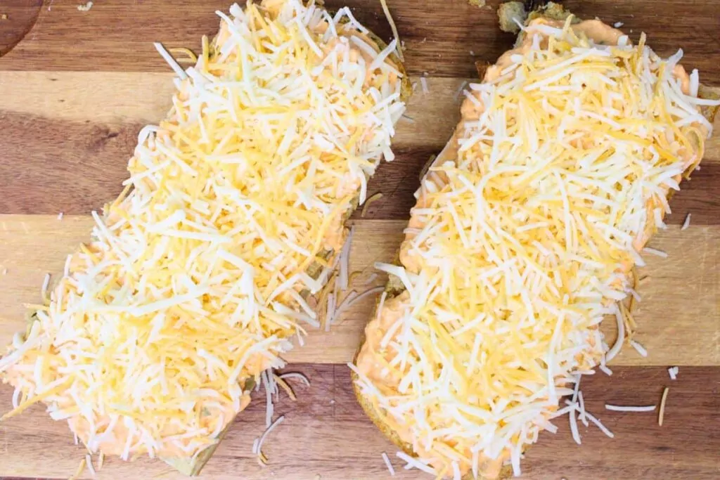 spread buffalo chicken dip and cheese over garlic bread