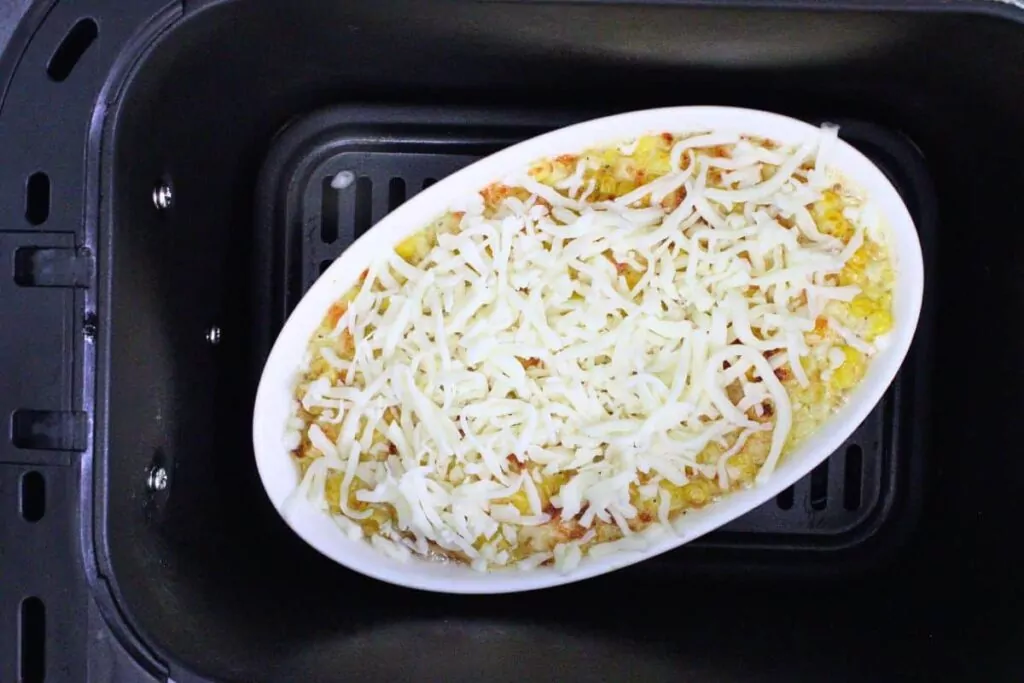 air fry korean corn cheese in baking dish and add remaining cheese on top